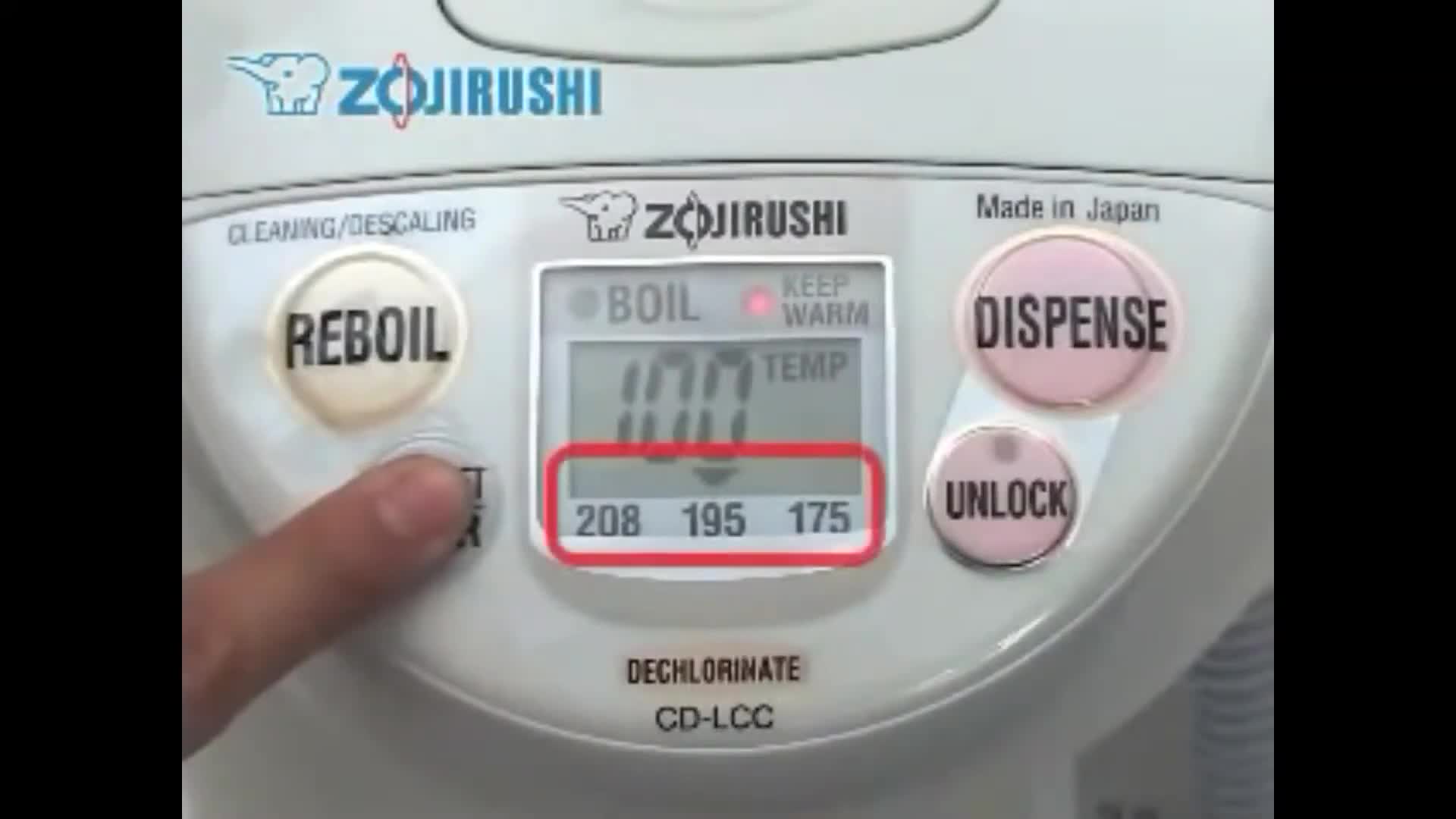 Person making tea with the hot water dispenser.