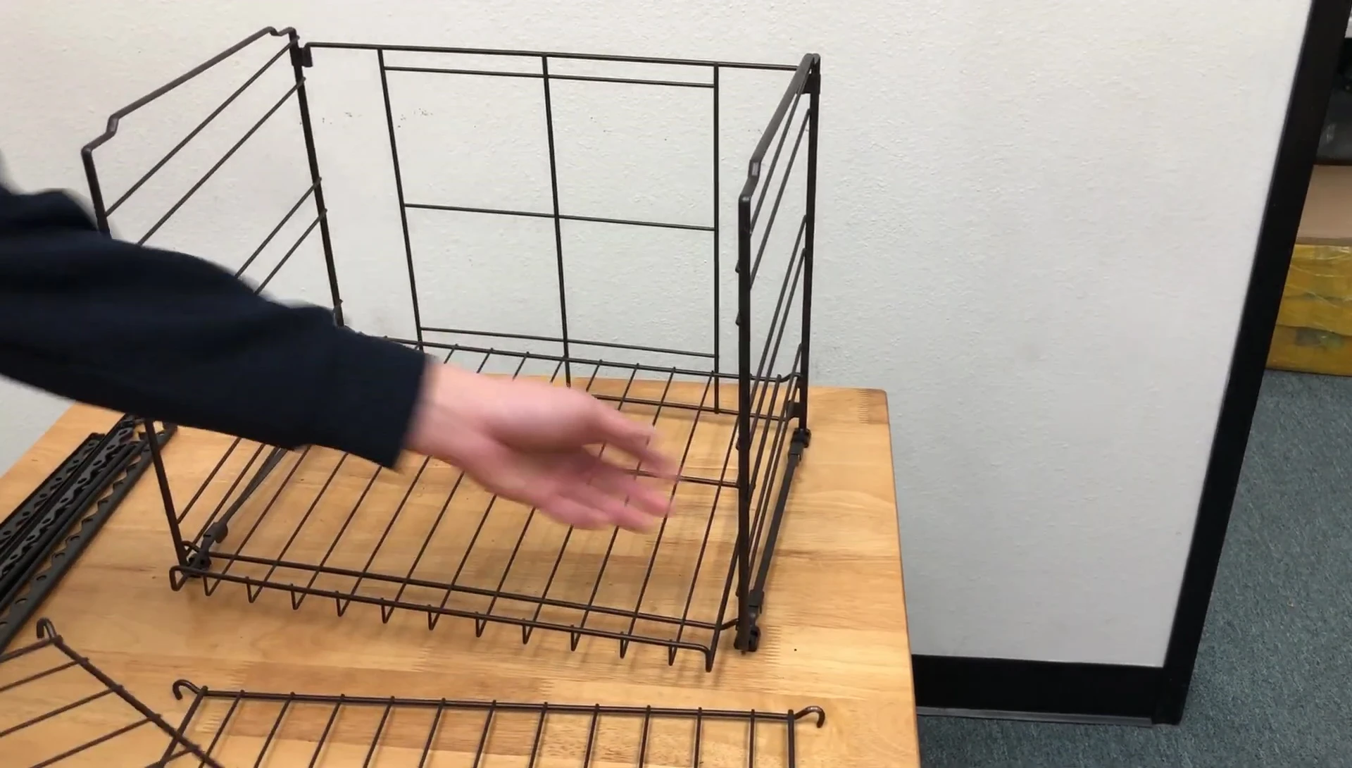Demonstration of attaching a subsequent rack, emphasizing the bottom-up approach.