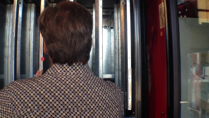 Adjust the rear spacers according to the menu instructions (e.g., third notch for 20oz contoured bottles). Squeeze the release mechanisms to adjust these.