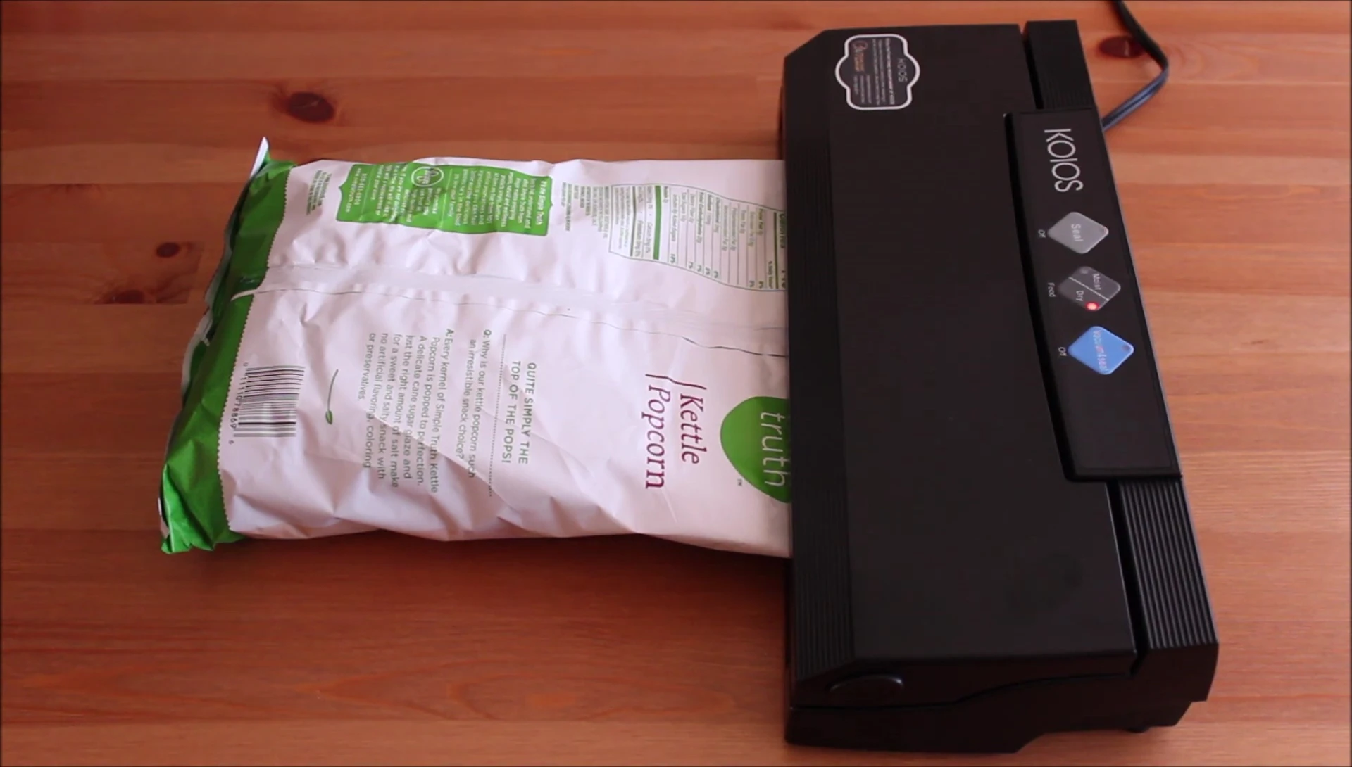 The reviewer giving a thumbs-up, a positive sign toward the vacuum sealer