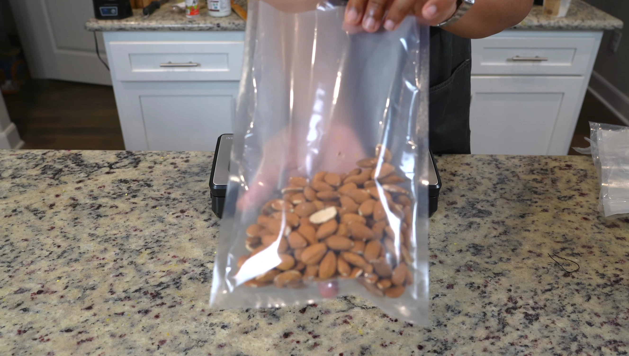 Preparing to vacuum seal almonds