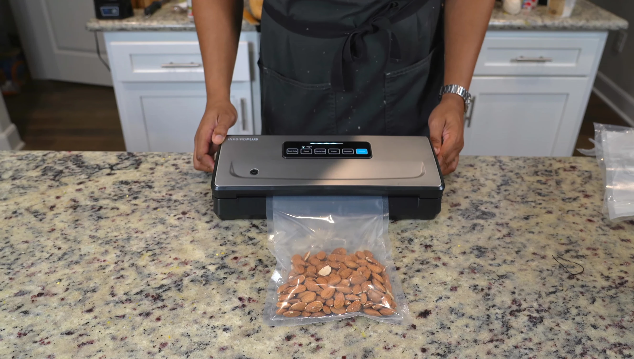 The INKBIRD PLUS vacuum sealing the almonds