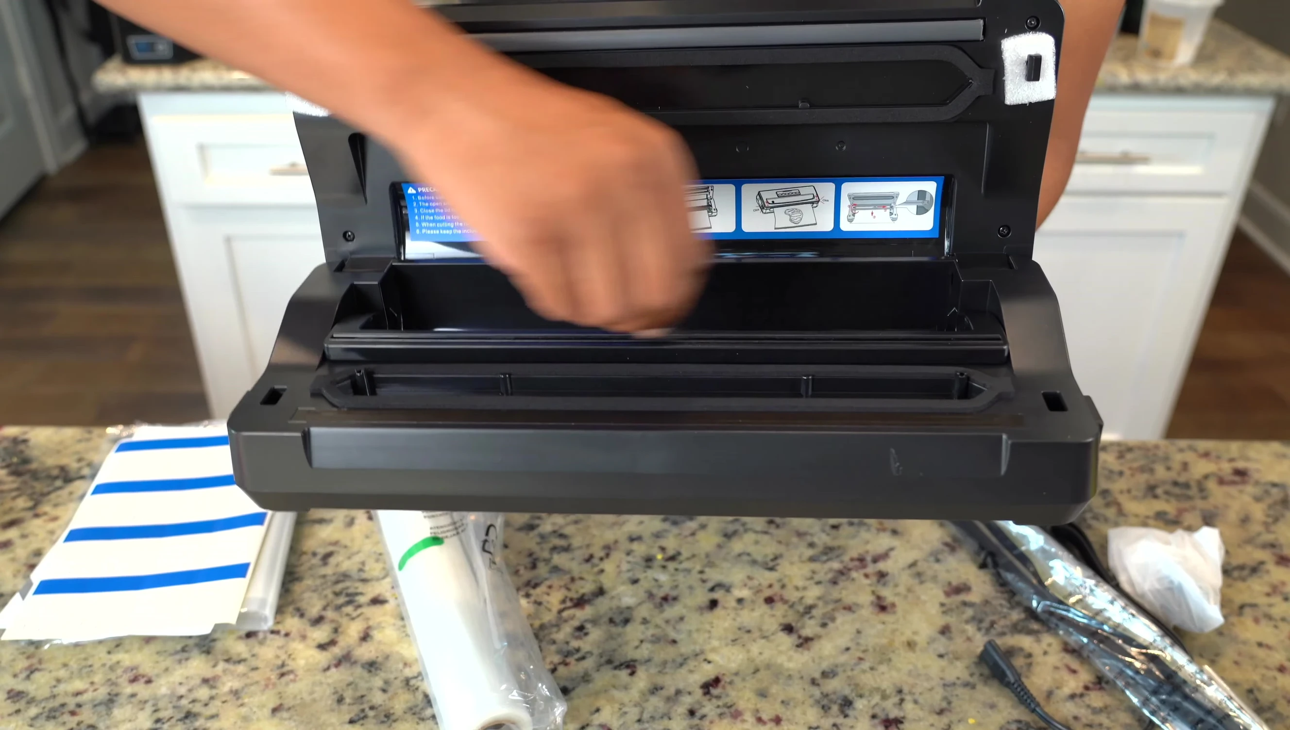The bag cutter and roll of bags