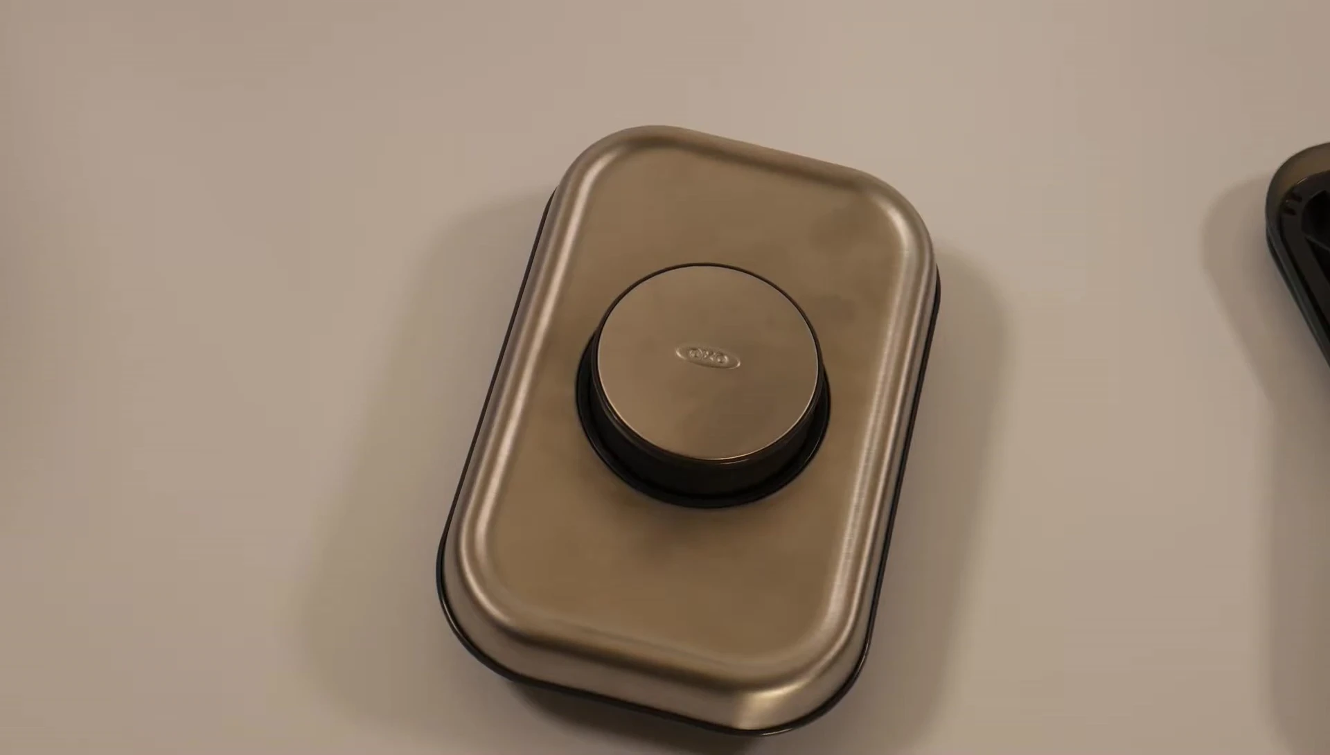 Demonstrating how to release a stuck button.
