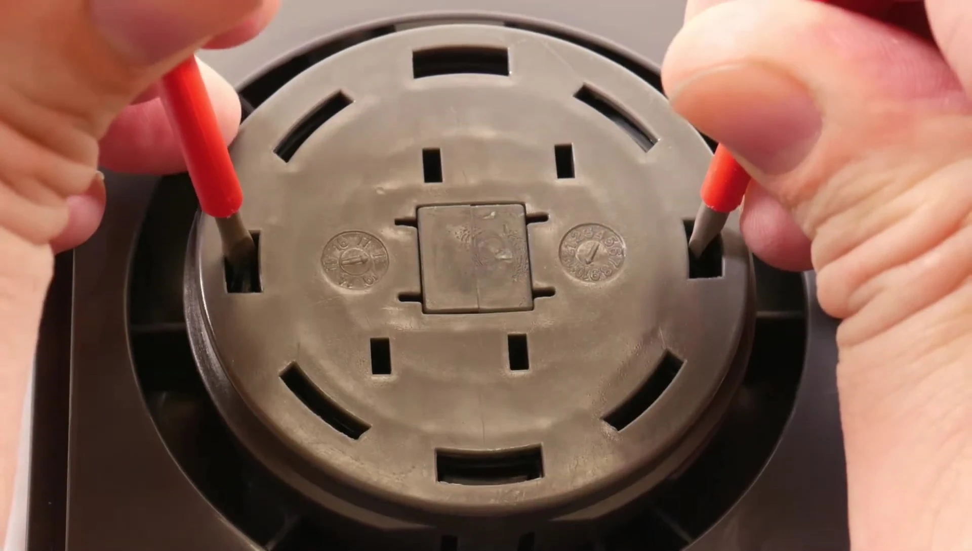 Button popping out after pressing the holes.