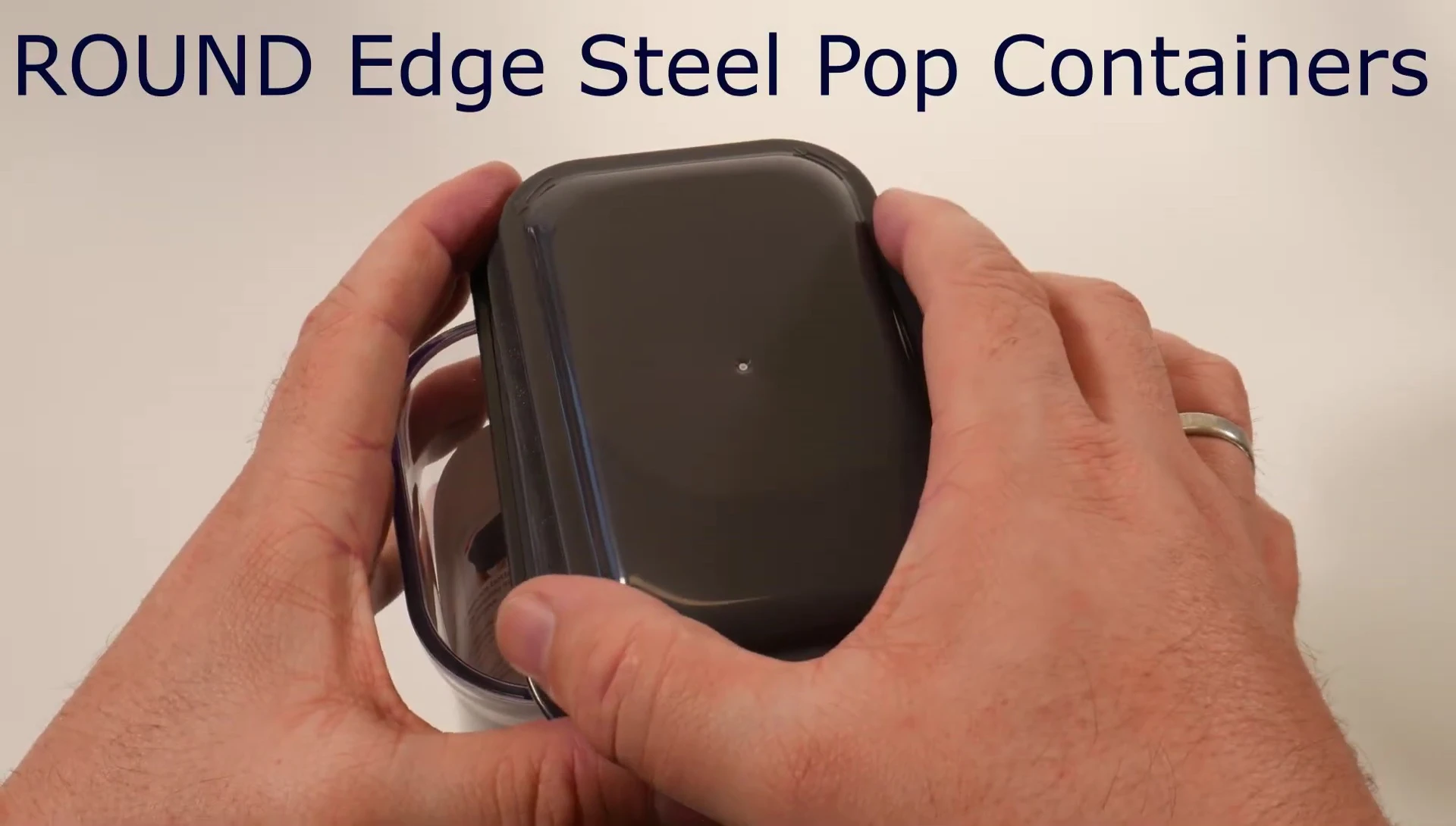 Unscrewing the bottom cover of the round-edged container.