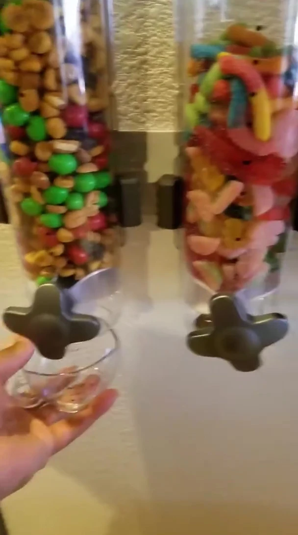 Image of the hand operating the dispenser