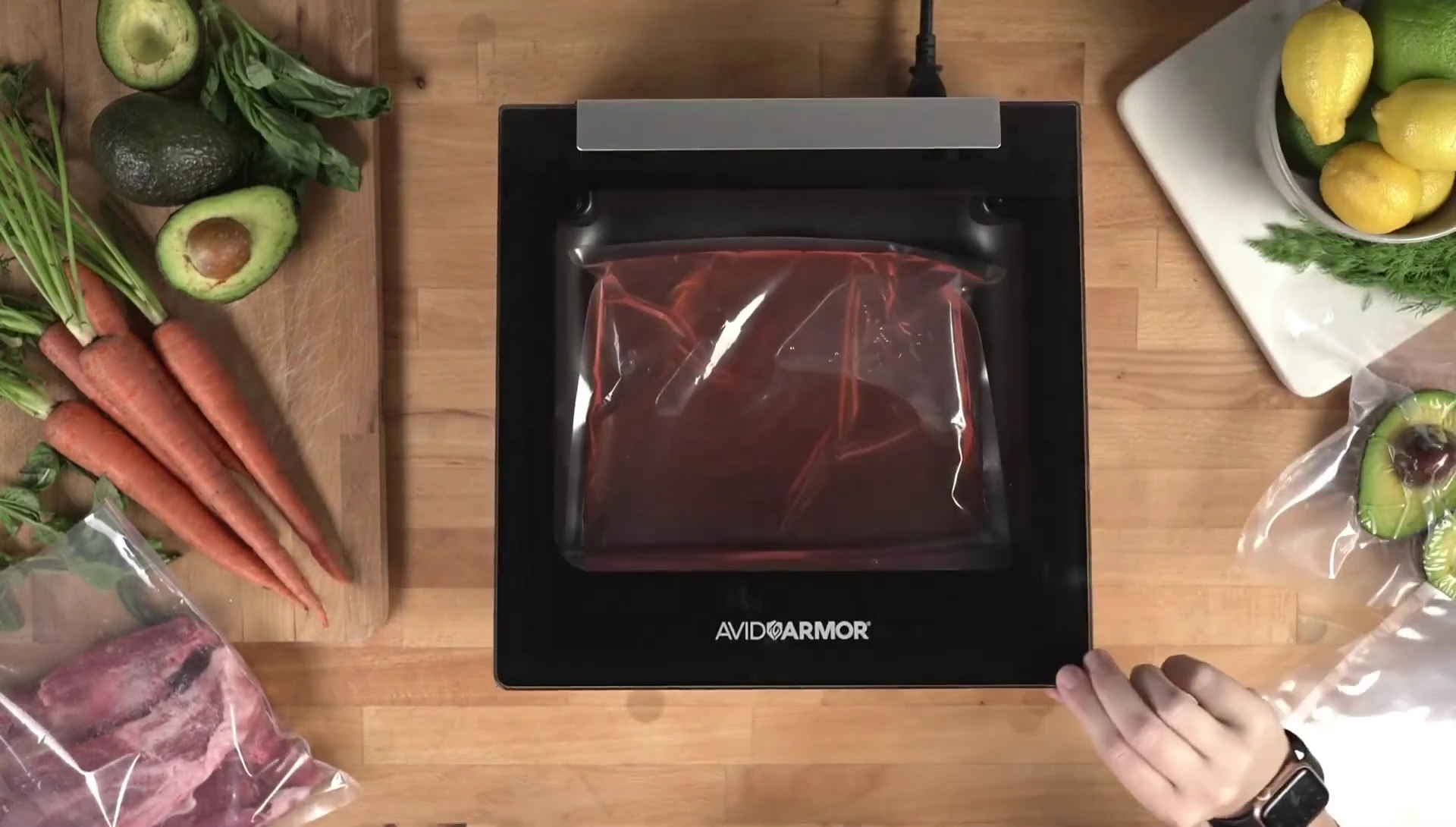 The control panel of the vacuum sealer showing the vacuum and seal time settings.