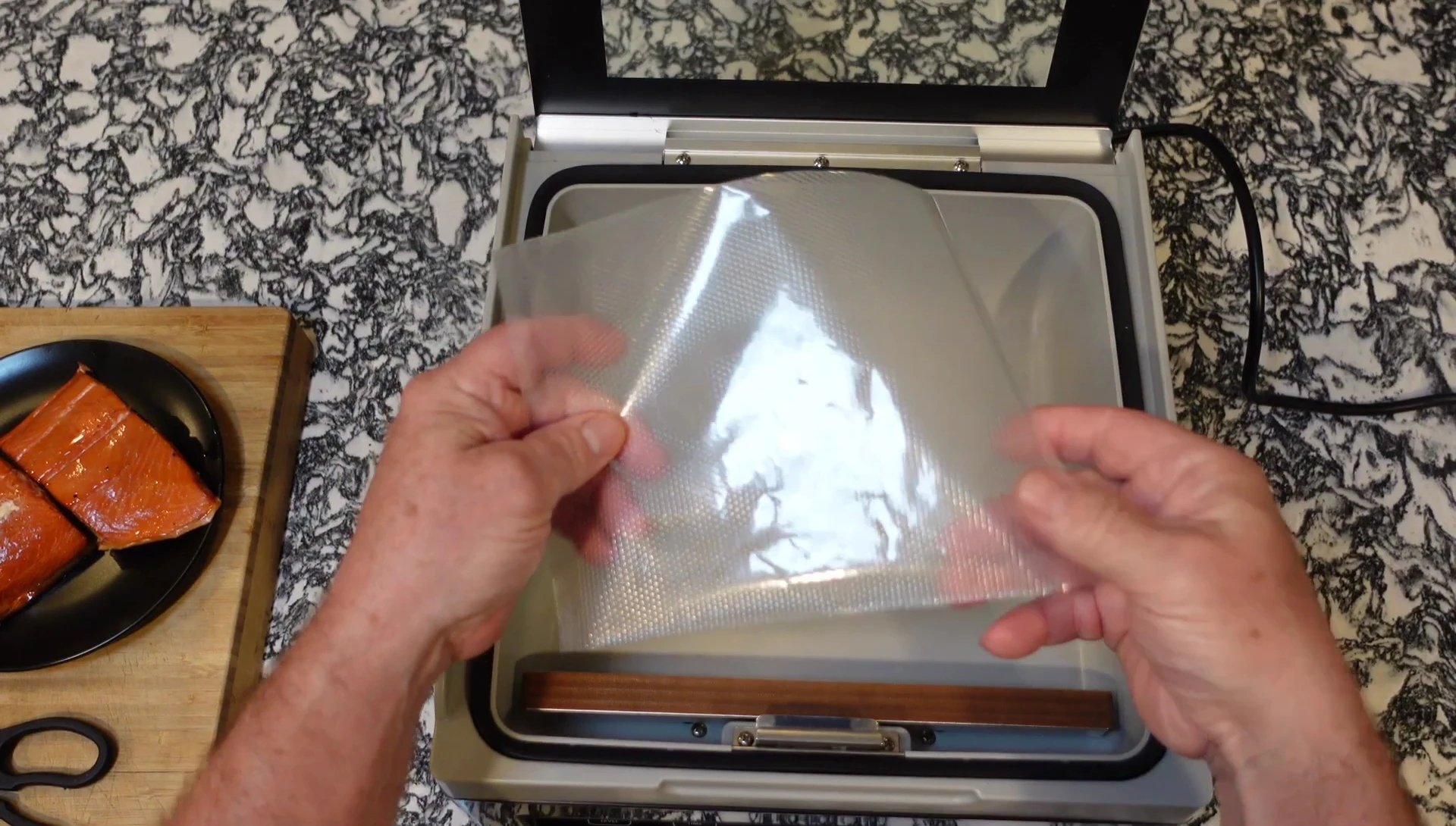 Placing the open bag under the clip