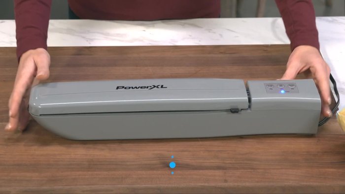 Place the sealer on a level, dry, heat-resistant surface and plug it into a dedicated outlet.