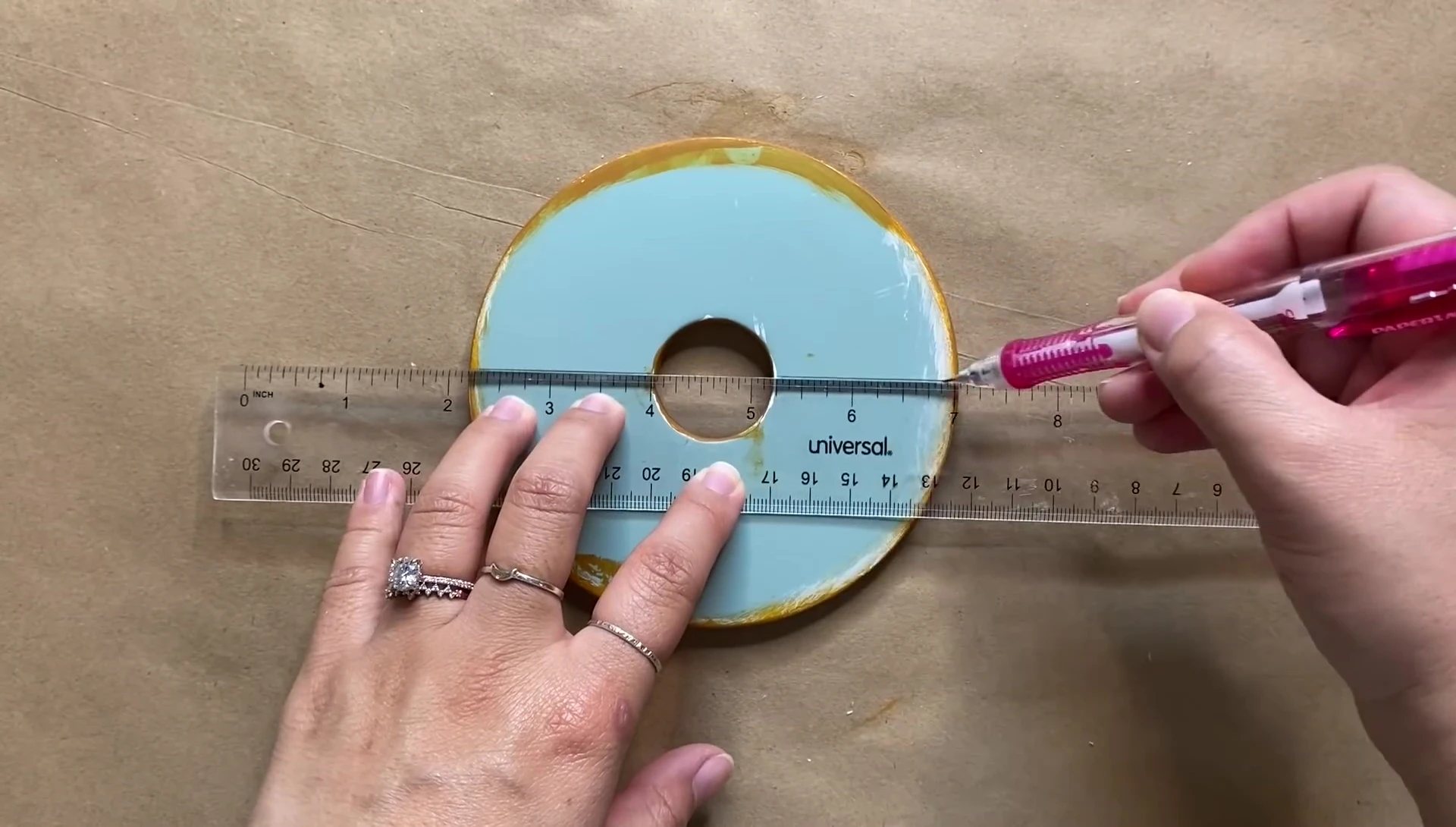 Wrapping the lid with raffia