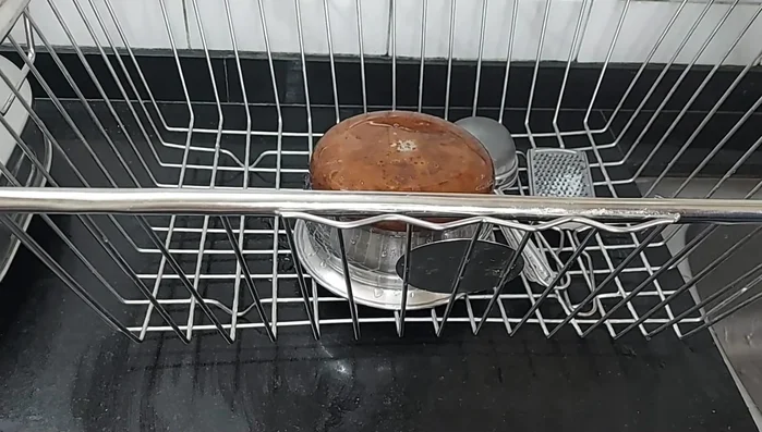 Trial and error: Using lemons under the steel basket to absorb water is inconvenient and requires drying.