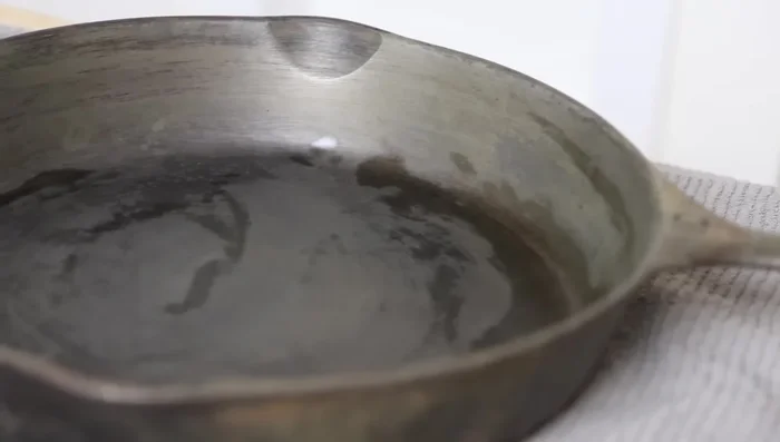 Dry the skillet completely with a clean paper towel.