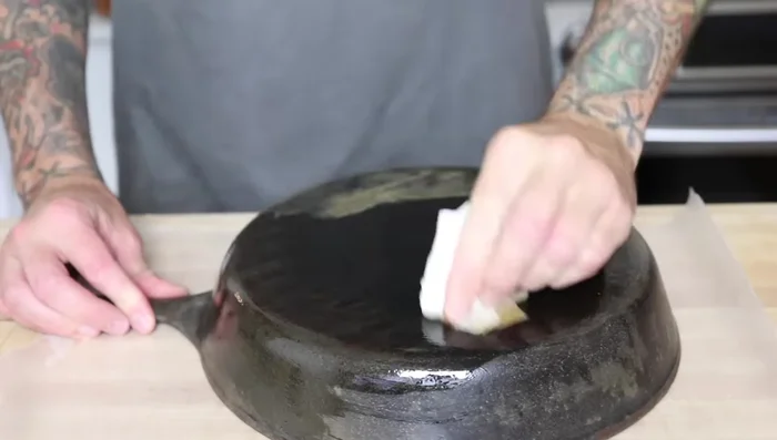 Bake for 20 minutes. Remove from oven, and while it's still hot (carefully!), apply another thin layer of canola oil. You should see it smoking.