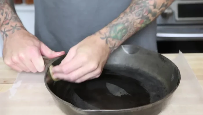 Bake for 20 minutes. Remove from oven, and while it's still hot (carefully!), apply another thin layer of canola oil. You should see it smoking.