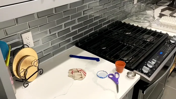 Optimize corner cabinet space by storing less frequently used items like extra tech and lighting.